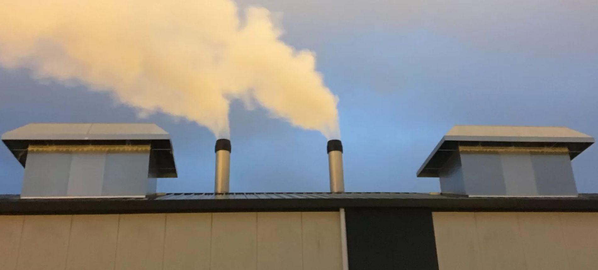 Two stacks letting out hot air after the CHP